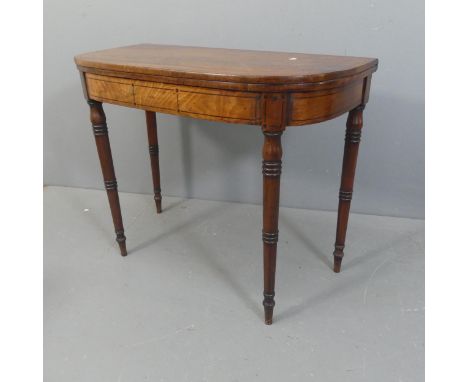 A Victorian mahogany fold-over card table, with rosewood stringing and raised on turned legs. Width 91cm, height 73cm, depth 