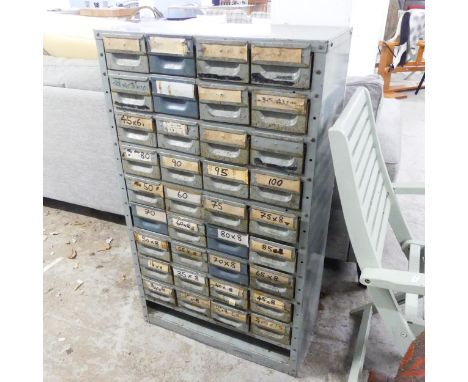 A vintage industrial 36 drawer tool chest. Width 62cm, Height 107cm, depth 30cm.
