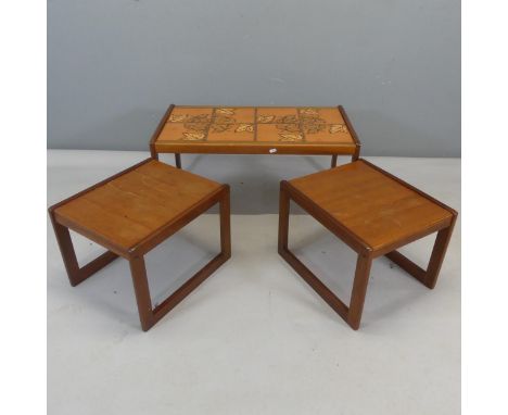 ENGLENDER - A mid-century teak tile-top coffee table, with two nesting tables. Largest width 85cm, height 40cm, depth 47cm.