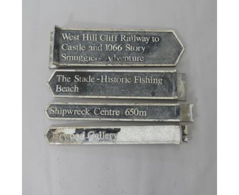 Four genuine painted cast metal Hastings street signs - "Jerwood Gallery", "Shipwreck Centre 650m", "The Stade - Historic Fis