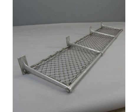 A vintage tubular aluminium luggage rack with original netting, from a British Rail mk.1 carriage. Length 177.5cm, depth 40cm