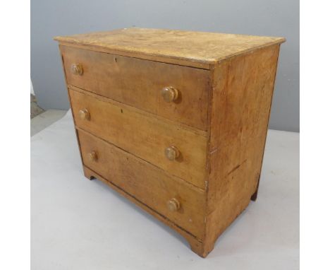 A vintage pine chest of three long drawers. Width 99cm, height 87cm, depth 53cm.