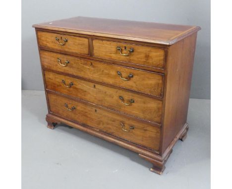 A Georgian mahogany and satinwood strung chest of two short and three long drawers, with walnut drawer fronts, brass pulls an