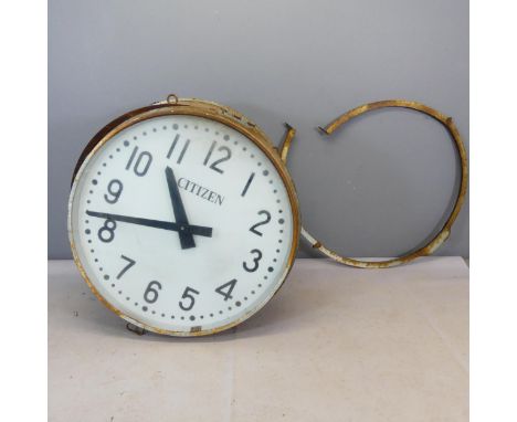 CITIZEN A large metal cased outdoor advertising clock with cast iron wall mounting casing. Approximate diameter 97cm, approxi