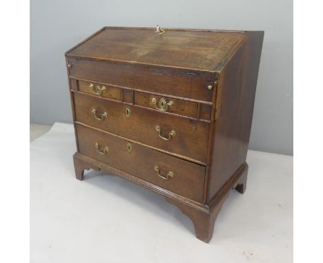 An 18th century oak bureau, with well fitted interior, four drawers and bracket feet. Width 95cm, height 94cm, depth 52cm.