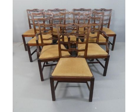 A set of ten Chippendale style mahogany ribbon back dining chairs with upholstered drop-in seats. (8+2)