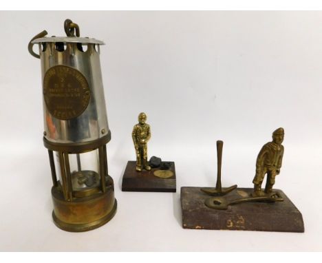 An Eccles miners lamp, 13in high including handle, twinned with two Welsh mining related ornaments 