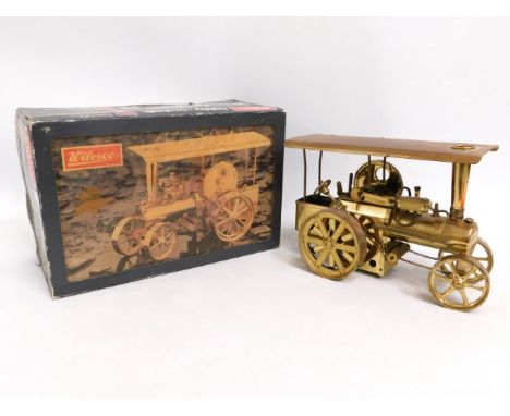 A boxed Wilesco brass steam traction engine, 11in long x 7.5in high