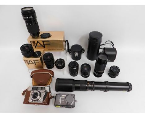 A Nikon 35-70mm lens with box, a Nikon 70-210mm lens with box, a Nikon 35-80mm lens, an Agfa Optima camera &amp; other access