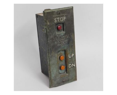 A bronze mounted lift button by J &amp; E Hall, Dartford