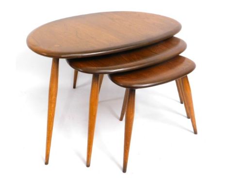 A retro nest of three Ercol elm 'pebble' tables