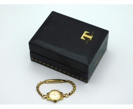 A cased ladies gold plated Tissot watch, winds &amp; runs