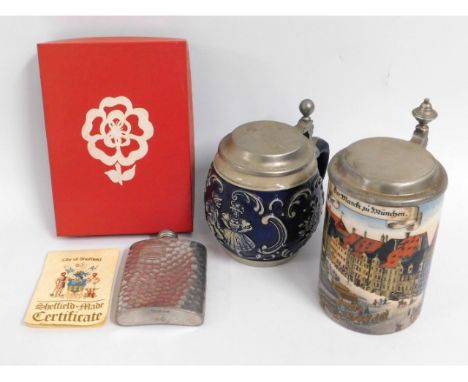 A decorative German stein featuring figurative town scene twinned with one other &amp; a pewter flask