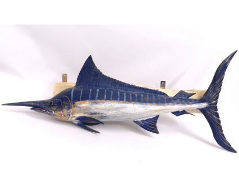 A mounted large painted shop display wooden model of a Striped Marlin, signed C. R. Evans, dated 1999, 52.5in long