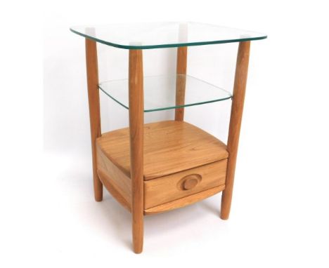 An Ercol light elm &amp; glass occasional table, 25.25in tall