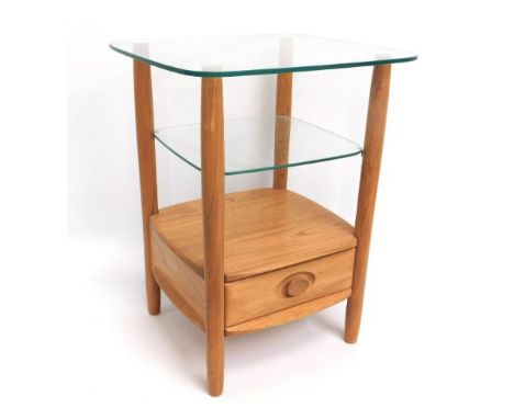 An Ercol light elm &amp; glass occasional table, 25.25in tall