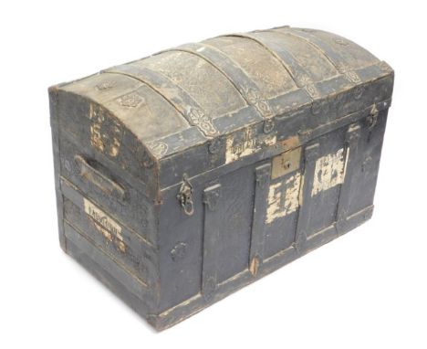 An early 20thC. trunk, one handle a/f, 32in wide x 17.5in deep x 24in high twinned with a low level nursing chair