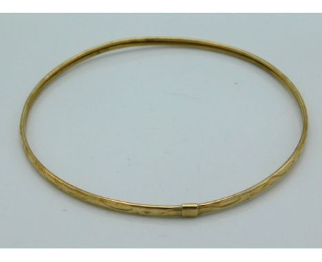 A 9ct gold bangle, 66mm diameter, 3g