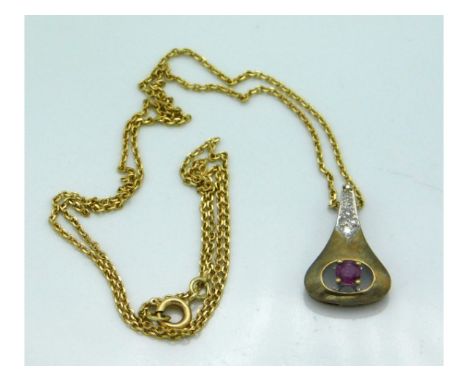 An 8ct gold chain &amp; pendant set with diamonds &amp; ruby, chain 17in long, pendant 29mm drop, 4.2g