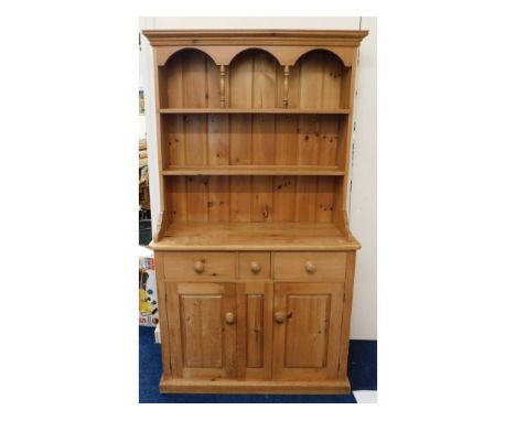 A compact, farmhouse pine dresser, with recessed doors &amp; drawers, 78in high x 44in wide x 18.5in deep