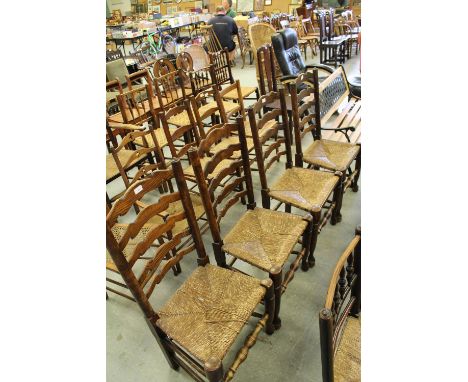 Four rush seated ladder back chairs