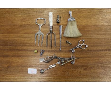 A Victorian silver and mother pearl handled ham fork, Sheffield 1895, a silver mounted crumb brush and a selection of other i