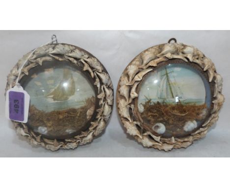 A pair of Edwardian shell-work souvenir dioramas, each with a marine lithograph in colours, mounted with shells and seaweed b