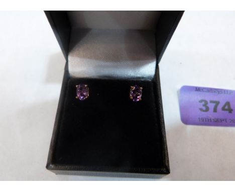 A pair of 9ct amethyst earrings. 1.1g gross
