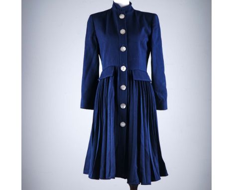 Runway-worthy sophistication defines this navy wool skirt coat from Valentino, crafted with the brand's signature refinement 