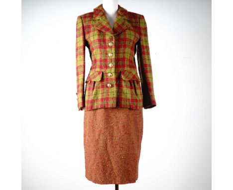 A stunning expression of understated luxury, this vintage Adolfo at Saks Fifth Avenue skirt suit commands attention with its 