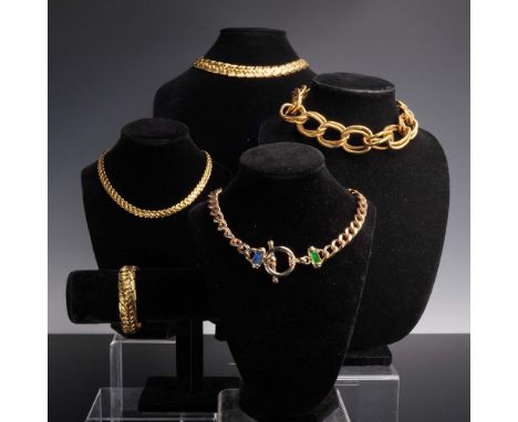 This five-piece collection of bold gold-tone fashion jewelry includes four chain-style necklaces and one coordinating bracele