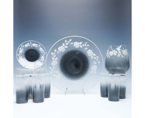 Elegant frosted glass tableware set featuring a graceful hand-painted white floral motif. This beautifully coordinated set in