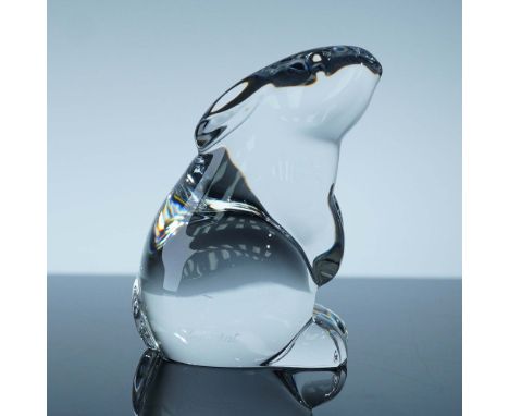 This clear Baccarat crystal figurine captures the serene form of a rabbit sitting upright, featuring softly rounded contours 