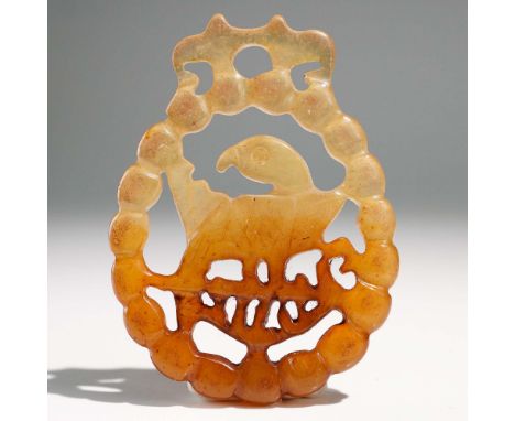 Finely carved Chinese jade pendant featuring a stylized phoenix with arched wings and detailed plumage, set within a decorati