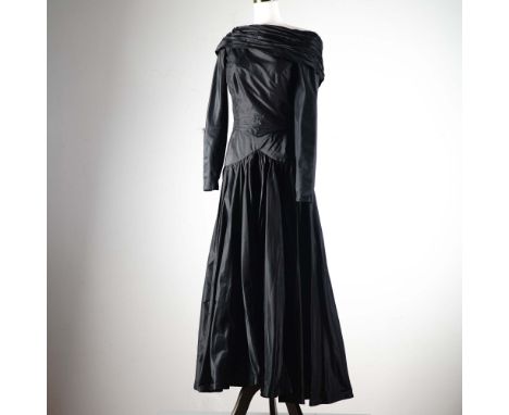 A dramatic black full-length evening gown by celebrated British designer Bruce Oldfield. This couture dress is crafted from p