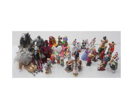An eclectic and colorful 36 piece collection of clown and character figurines and dolls featuring well known makers such as L