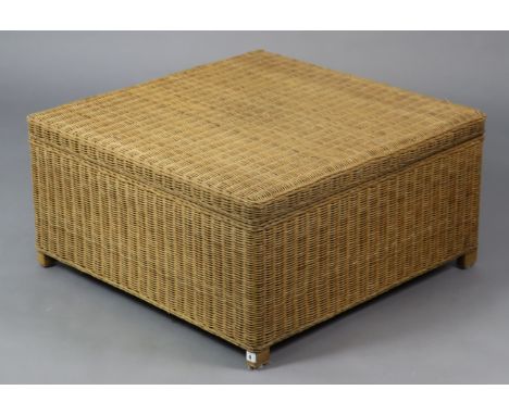 A wicker storage trunk, 79cm square x 40cm high.