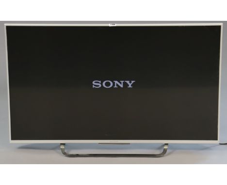 A Sony Bravia 43” colour television with a remote control. 