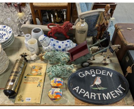 A vintage Pyrene fire extinguisher; a cast-iron oval sign “GARDEN APARTMENT”, 40cm &amp; 28cm; three pub advertising figures;