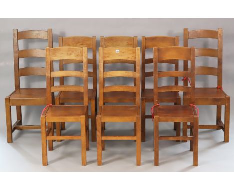 A matched set of eight hardwood ladder-back dining chairs each with a hard seat, and on square legs with plain stretchers.