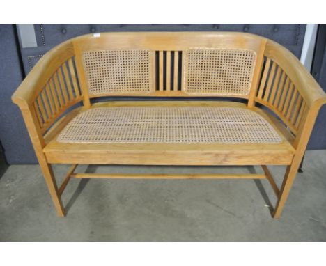 A cane seated bench - 125cm long