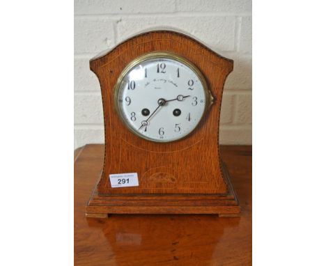 A 19th Century oak case French Mantle Clock - strikes hours on gong - 8 day movement - Arabic numerals to white enamel dial