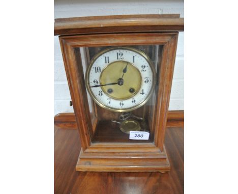 An American striking mantle clock - in working order - 30cm high
