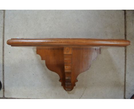 An oak clock bracket - 48cm wide x 28cm