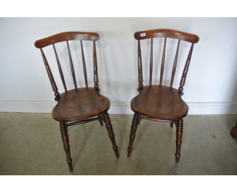 A pair of Victorian stick back chairs