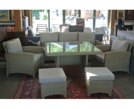 A Bramblecrest casual dining set consisting of a three seat sofa, two armchairs, two footstools and a square dining table - o