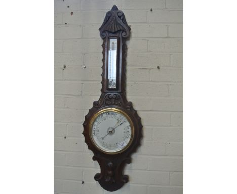 A 1930s carved oak barometer with a thermometer over a silvered dial, signed Benetfink & Co Cheapside - 95cm - in good condit
