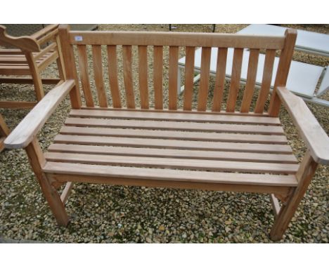 A Bramblecrest teak flat arm bench - has a small split to the arm - 130cm wide