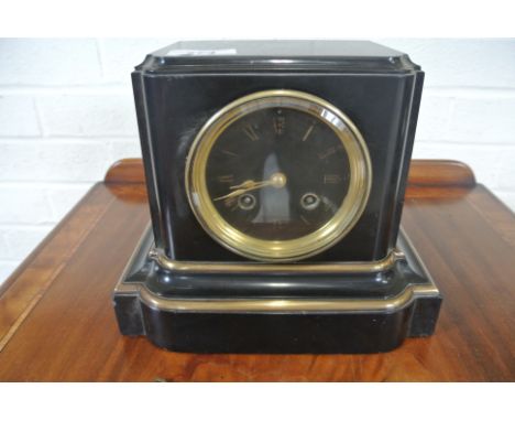 A small 19th Century marble striking mantle clock striking on a bell - in working order - 20cm high