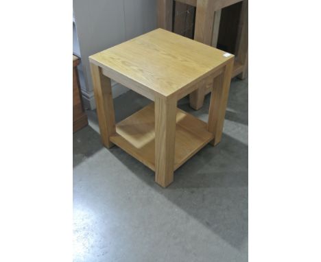 An ex display oak lamp table